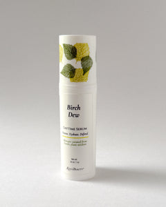 Bottle of Birch Dew Daytime Serum on a gray background