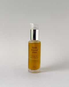 Bottle of Nordic Renewal Elixir facial oil on a light gray background